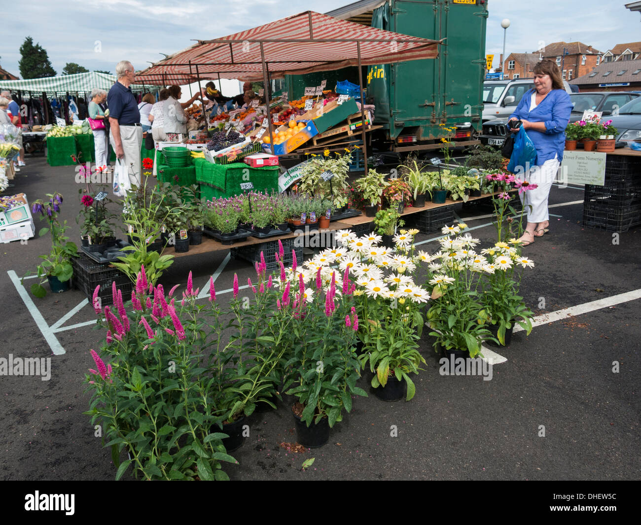 Open air market stall selling flowers fruit and vegetables in Sheringham Norflolk England Stock