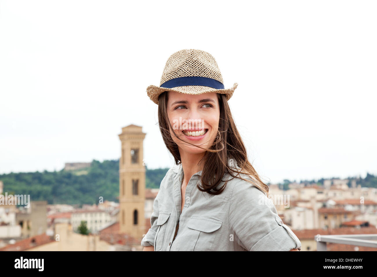 Young woman wearing straw hat, Florence, Tuscany, Italy Stock Photo