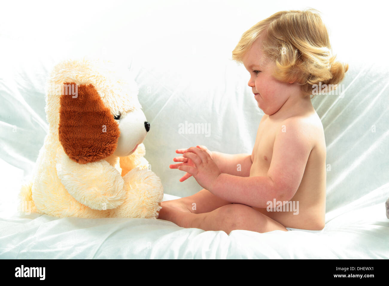 cute young child with cuddly toy Stock Photo