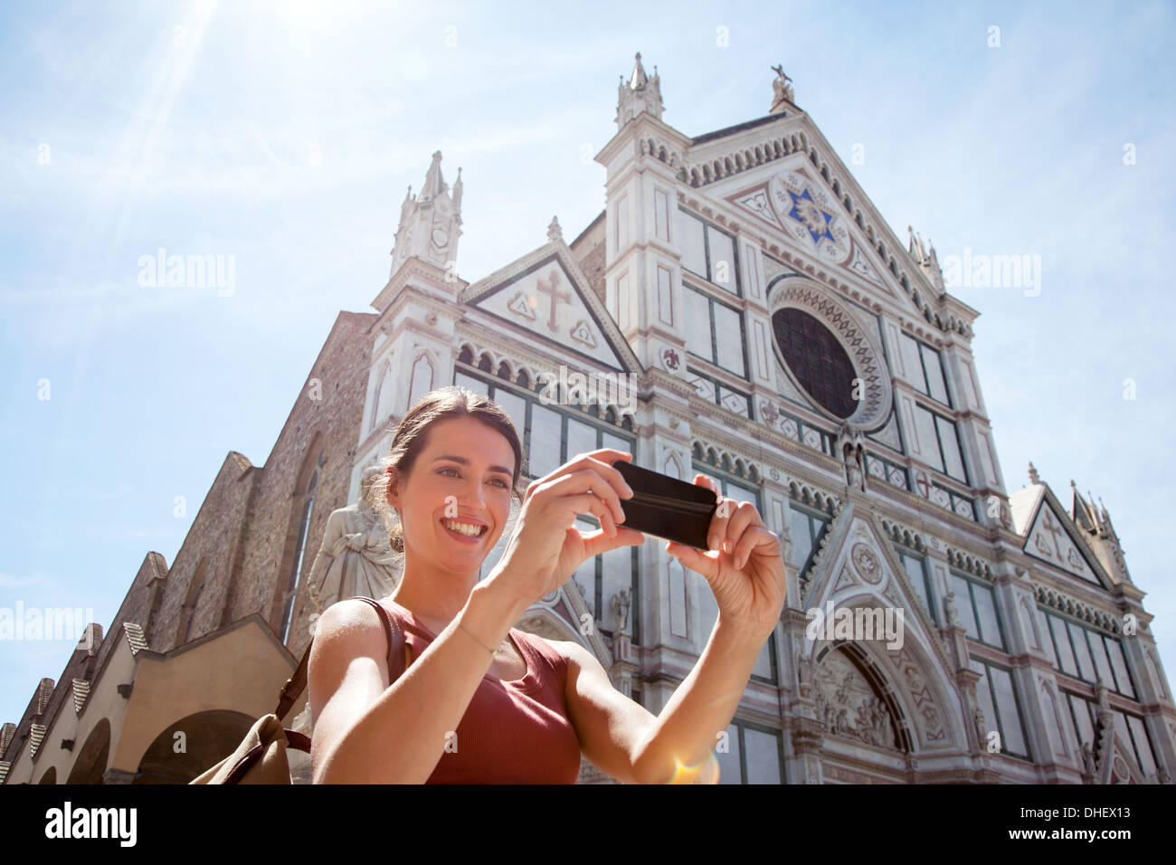 Woman outside Santa Croce church, Piazza di Santa Croce, Florence, Tuscany, Italy Stock Photo