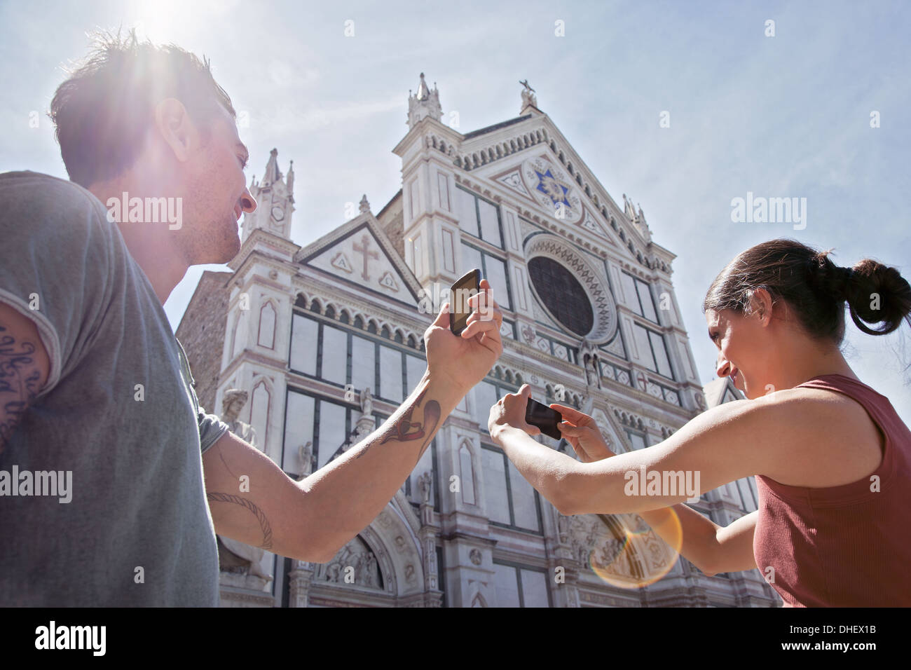 Man and woman photogrpahing Church of Santa Croce, Piazza di Santa Croce, Florence, Tuscany, Italy Stock Photo
