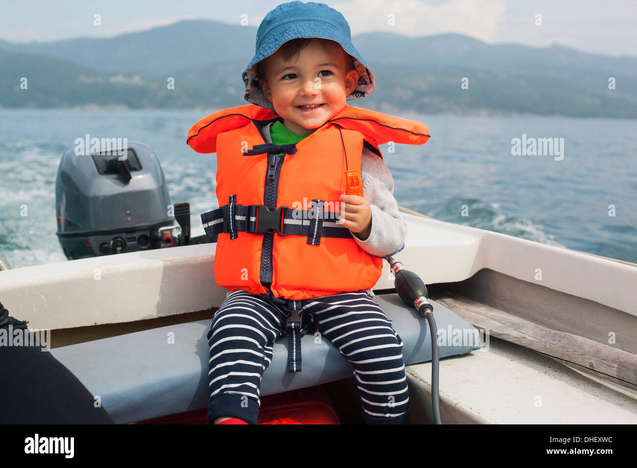 Boy enjoying boat ride Stock Photo