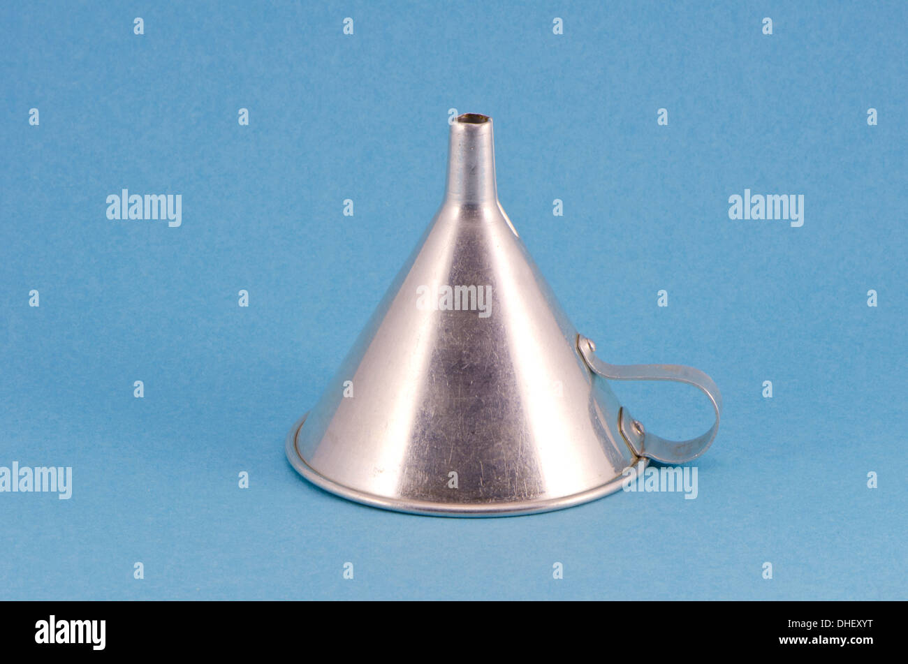 one retro metal funnel hopper tool on blue background Stock Photo Alamy
