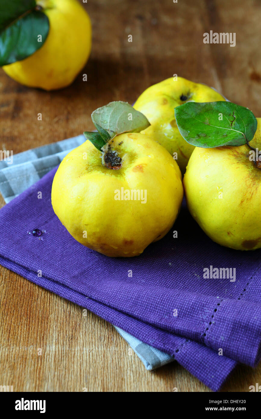 Natural ripe quince on the wooden table, food Stock Photo