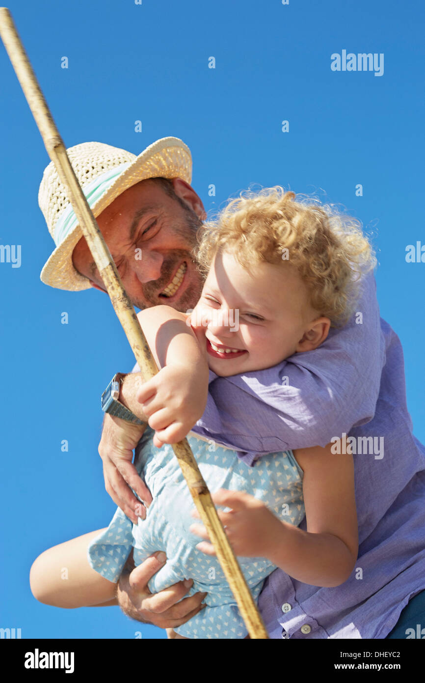 Female toddler and father with fishing net, Utvalnas, Gavle, Sweden Stock Photo