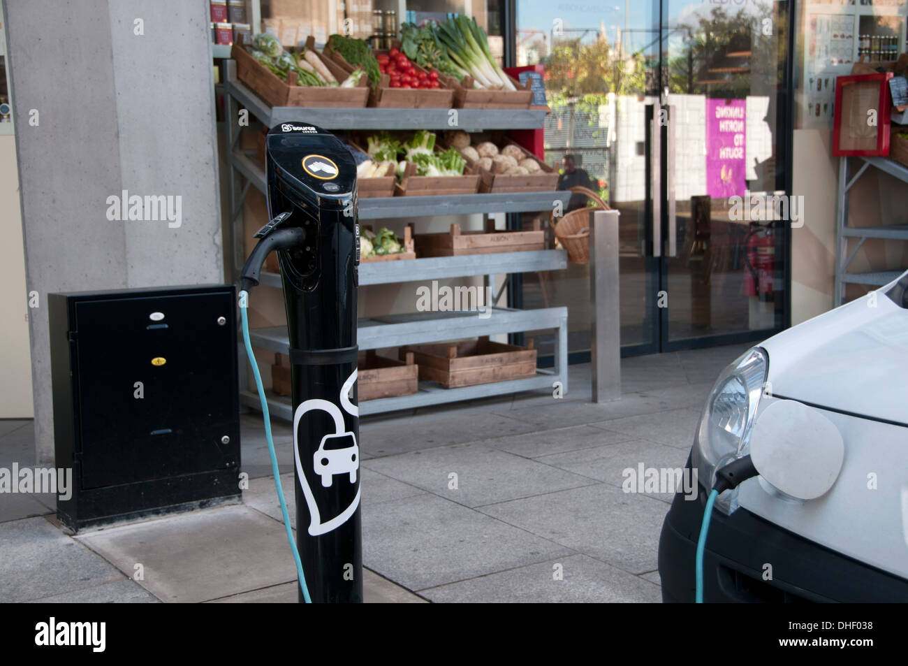 Charging electric car on the street Stock Photo Alamy