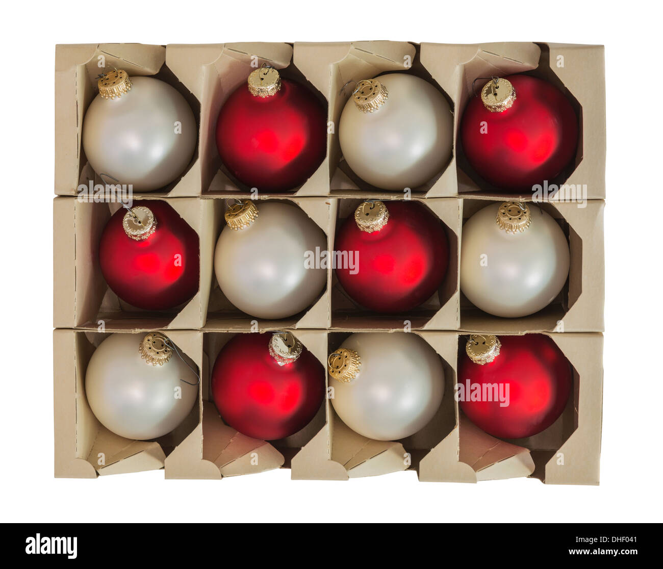 Christmas ornament decorations in vintage cardboard box isolated. Stock Photo