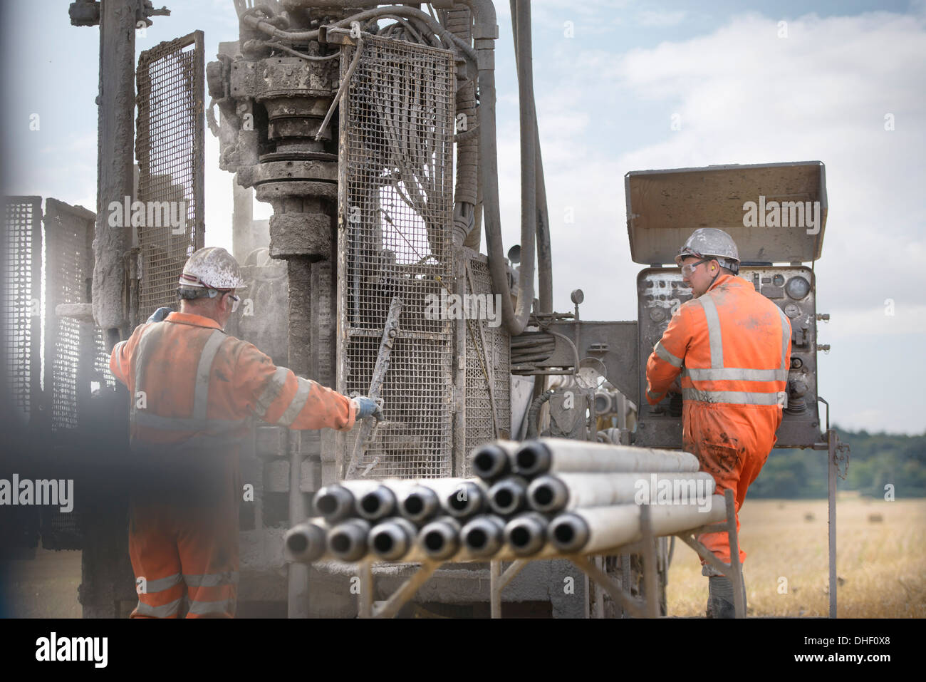 Drilling rig workers operating machinery Stock Photo