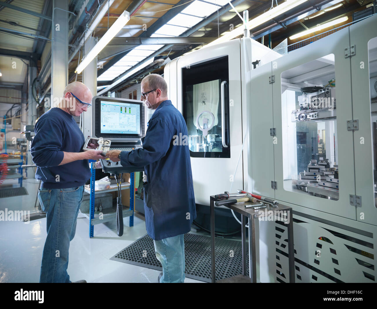 Computer controlled manufacturing hires stock photography and images