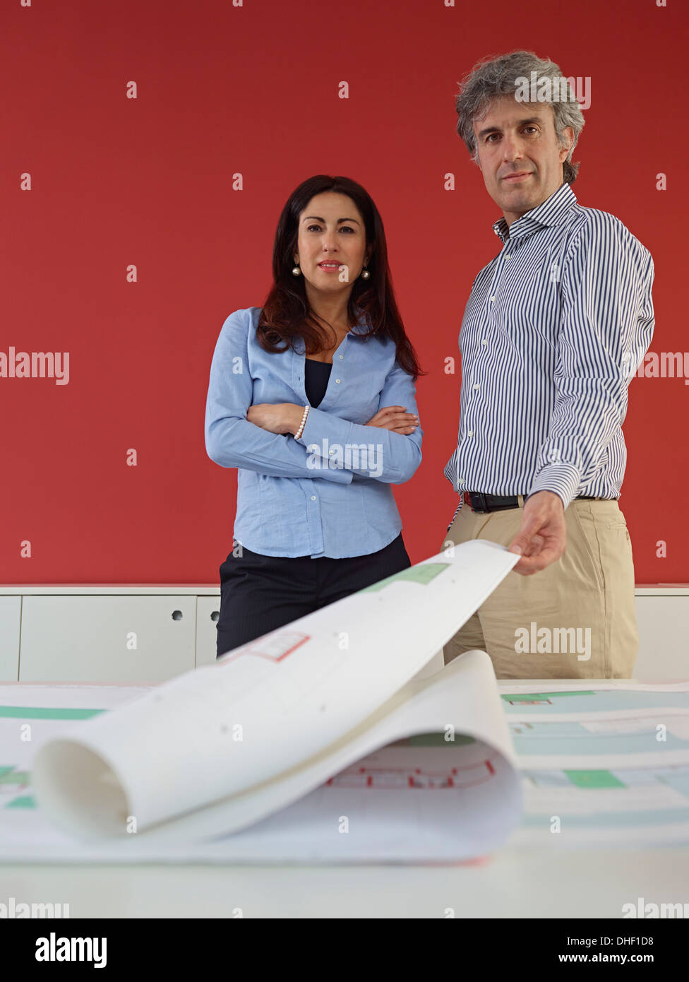 Two architects with blueprints Stock Photo