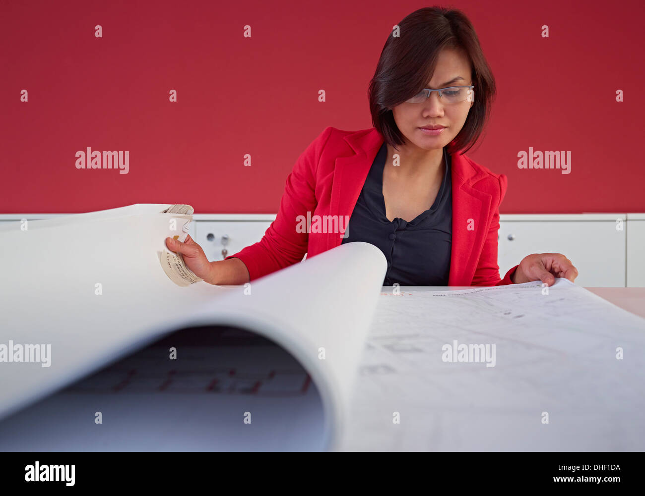 Female architect with blueprints Stock Photo