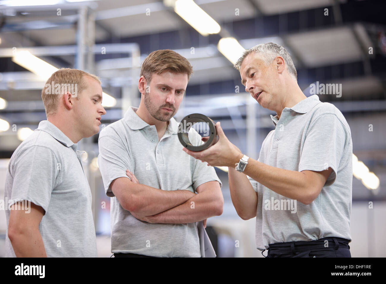 Manager discussing component in engineering factory Stock Photo