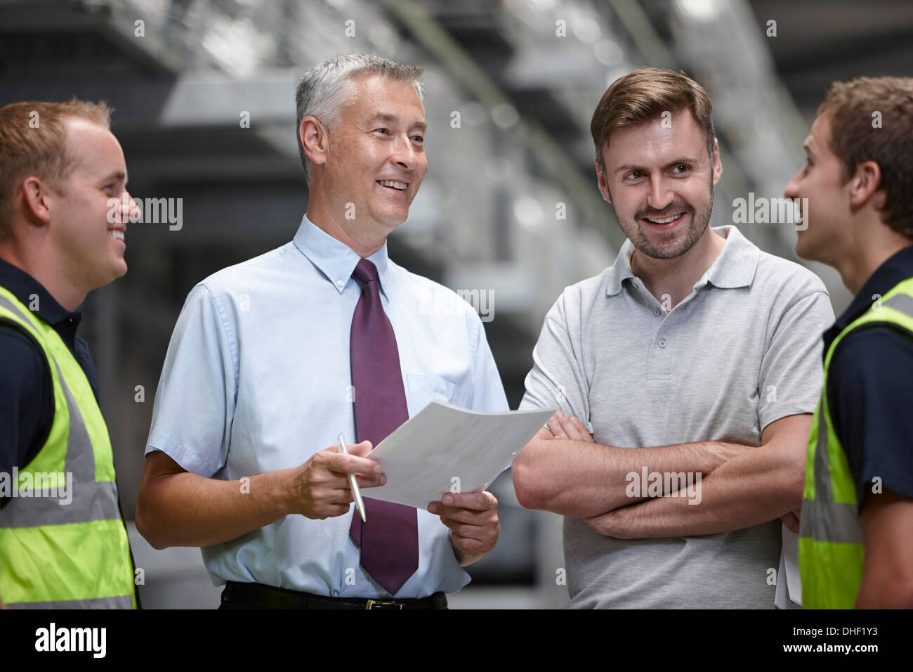 Warehouse workers and manager in engineering warehouse Stock Photo