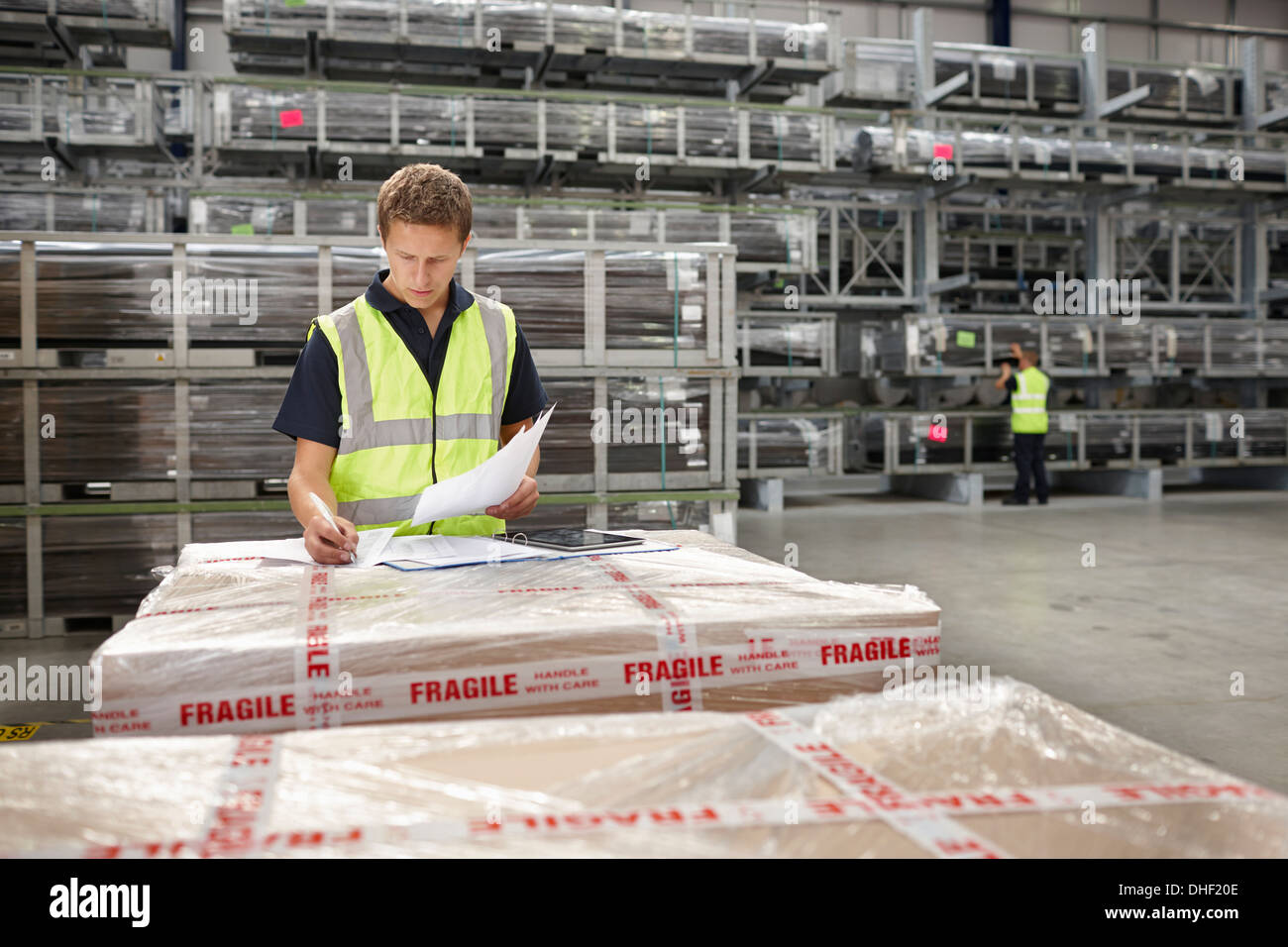 Warehouse worker checking order in engineering warehouse Stock Photo