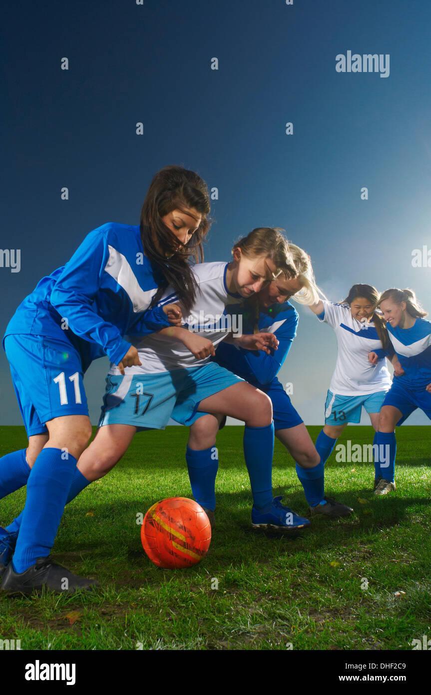 Young women playing football Stock Photo