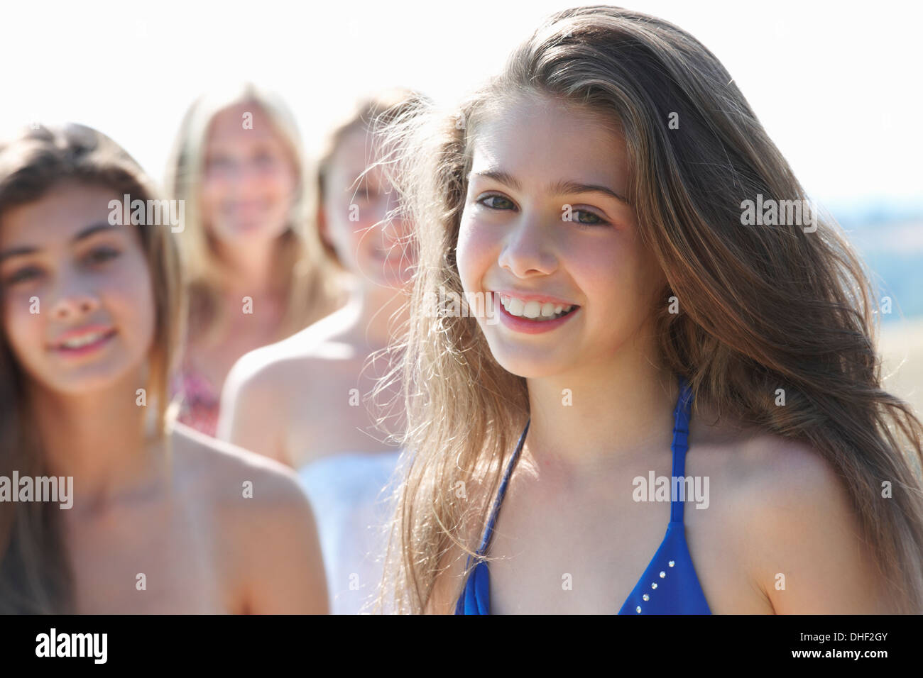 Portrait of girl with sisters in background Stock Photo