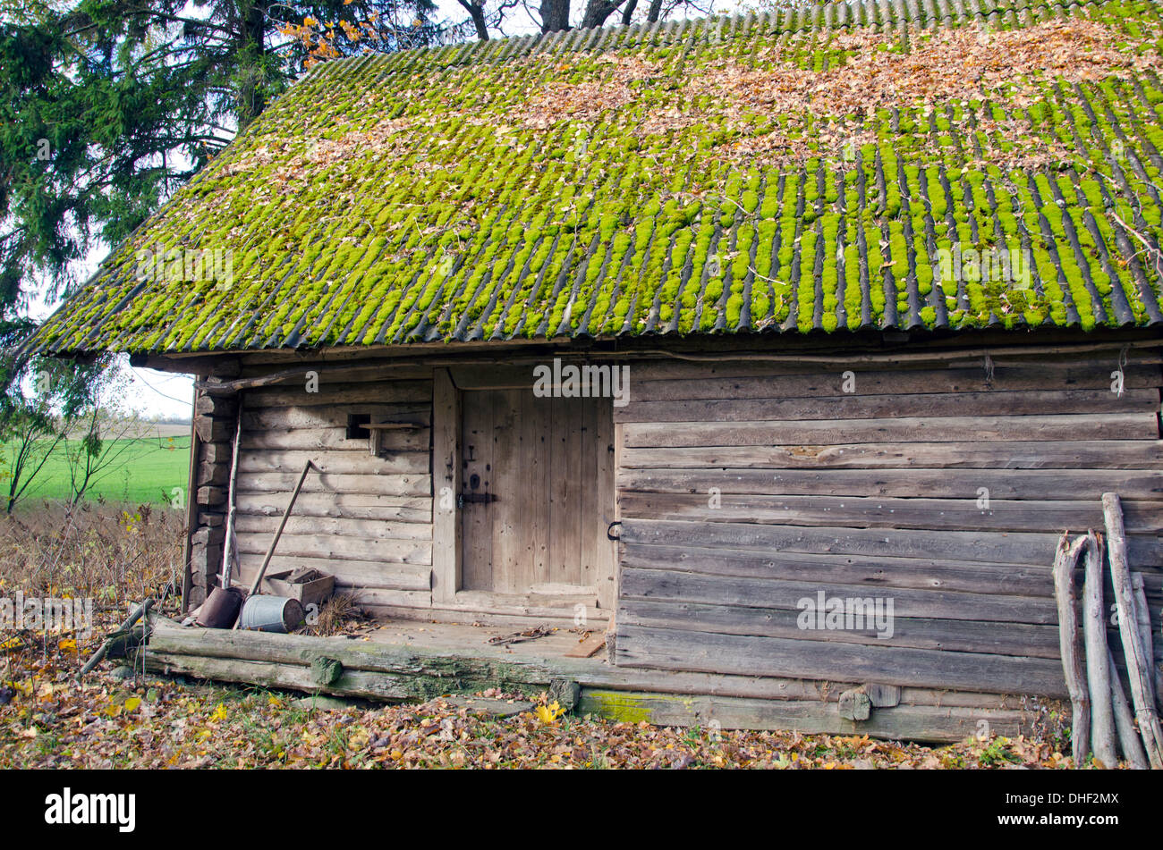 historical wooden farm barn with green moss roof Stock Photo - Alamy