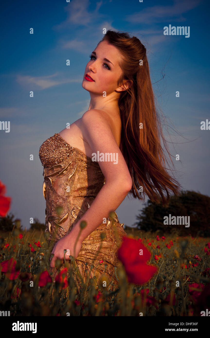 Young pretty model in poppy field Stock Photo