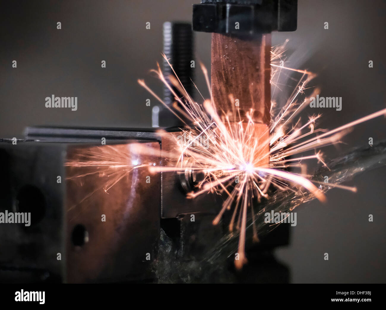 Spark from wire erosion machine in factory Stock Photo