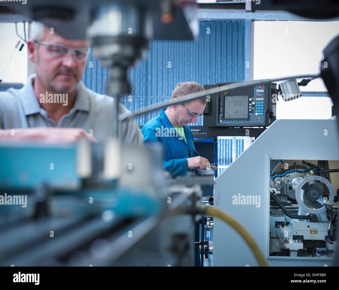 Lathe operators working in factory Stock Photo