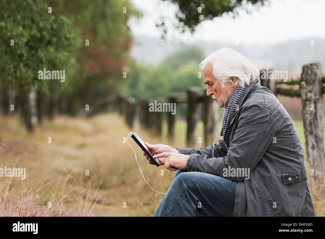 Senior man using digital tablet Stock Photo