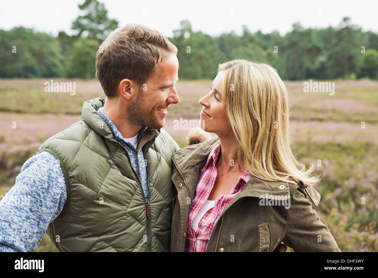 Mid adult couple smiling face to face Stock Photo