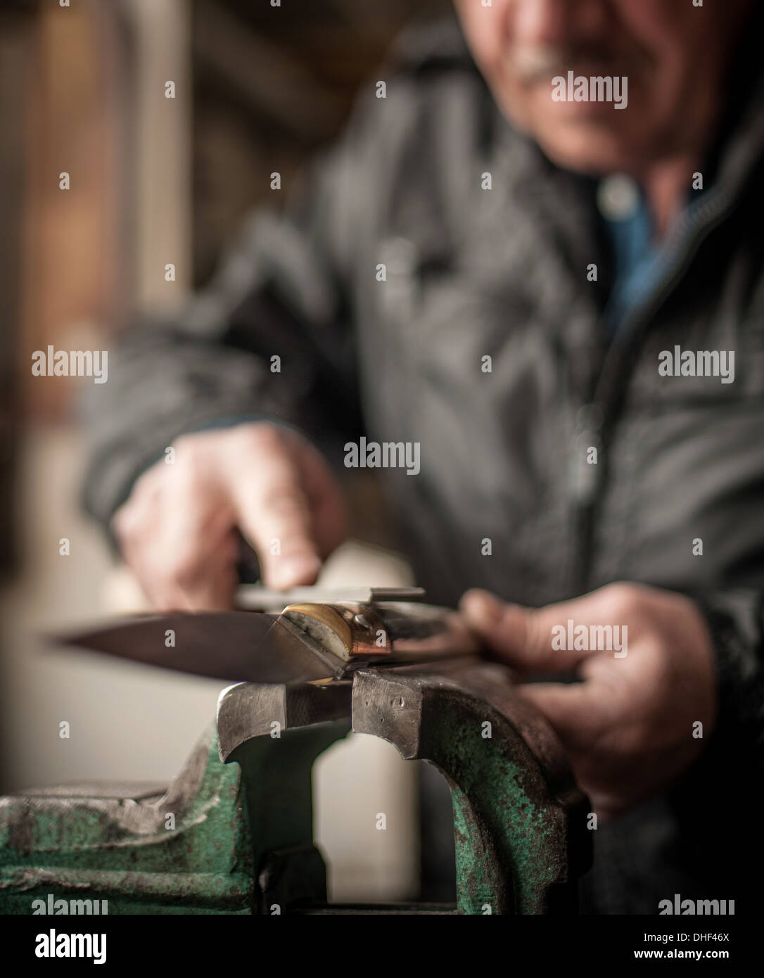 Man making knife, Barumini, Sardinia, Italy Stock Photo