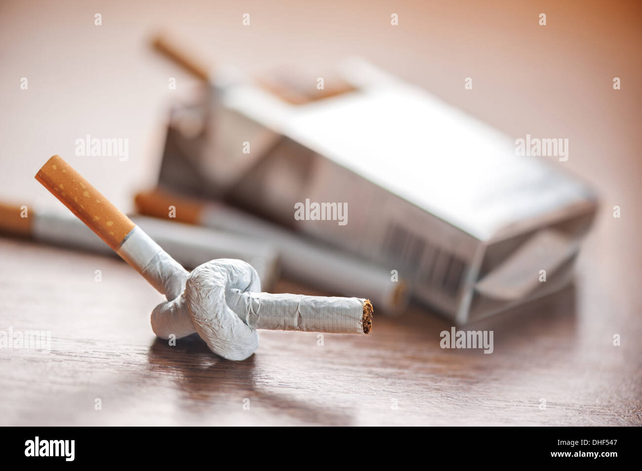tied cigarette on table closeup Stock Photo