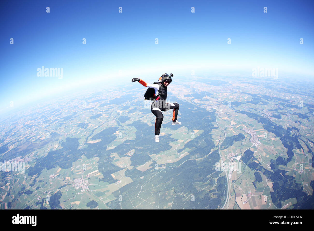 Female skydiver free falling above Leutkirch, Bavaria, Germany Stock Photo