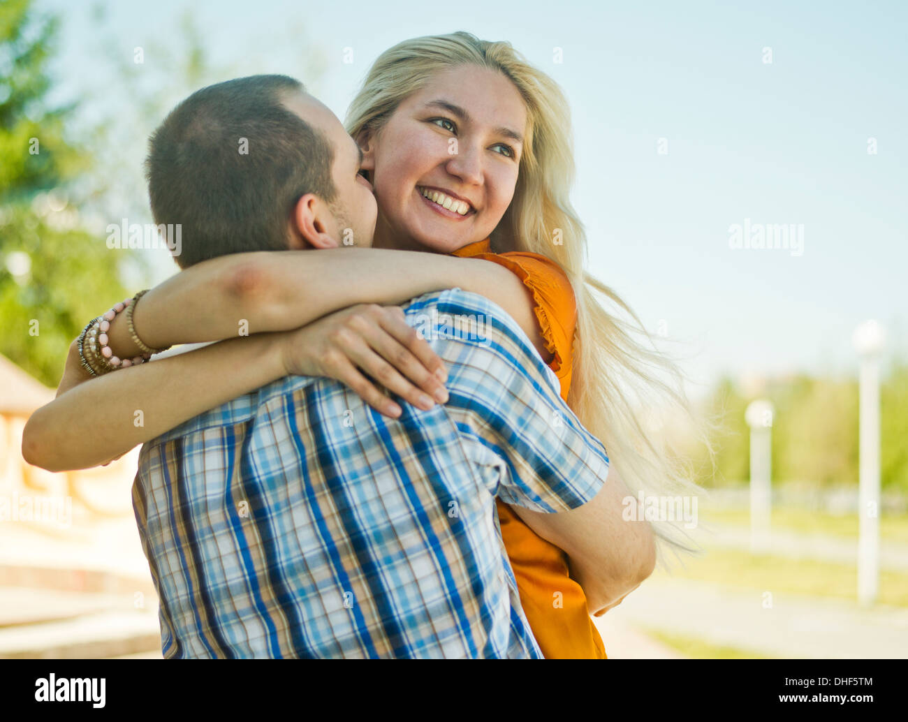 Happy young couple embracing Stock Photo