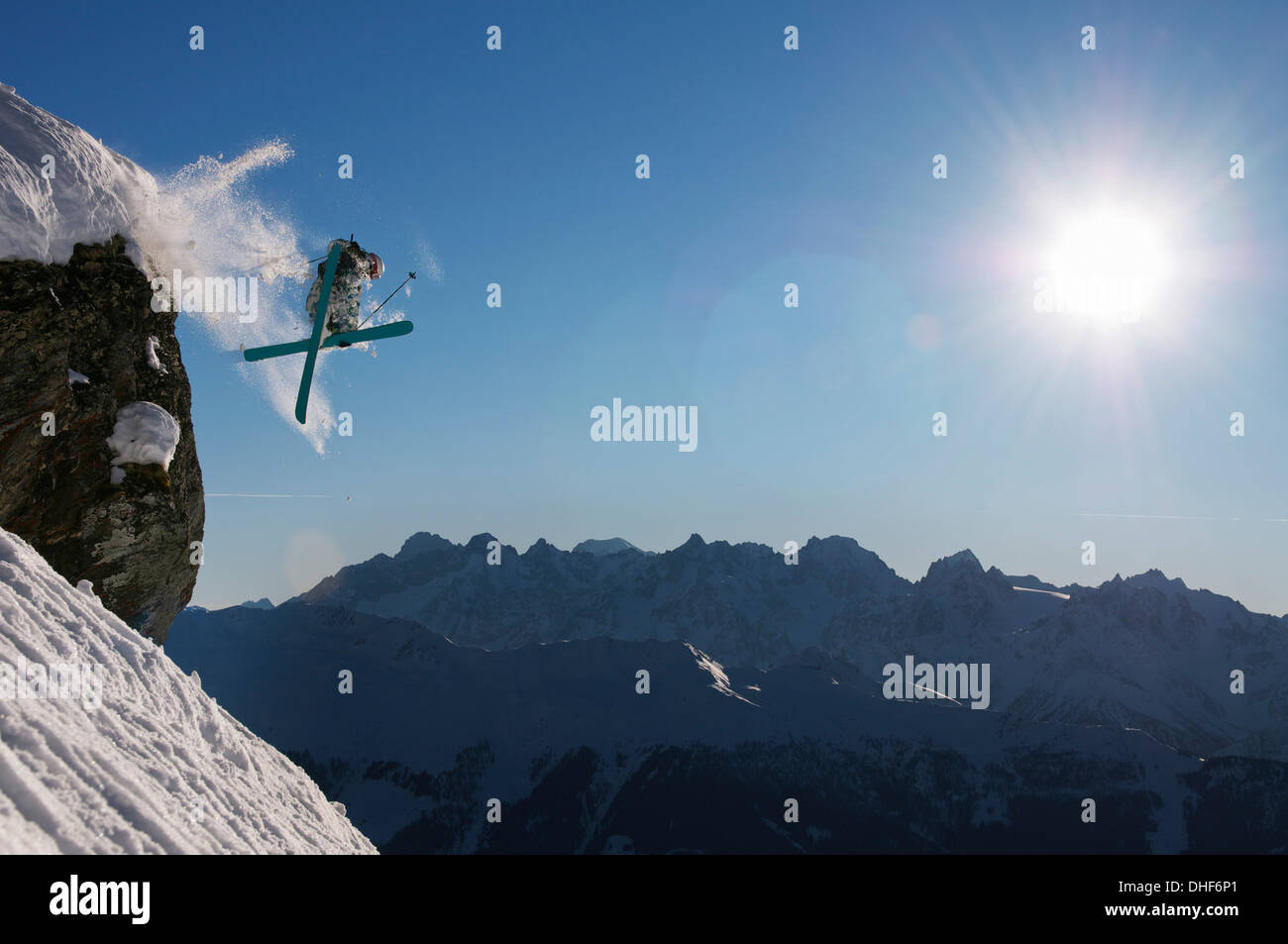 Man skiing off cliff, Verbier, Switzerland Stock Photo