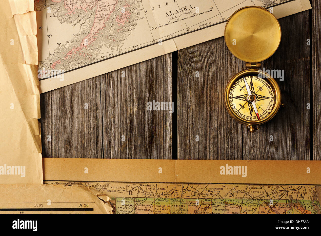 Antique compass over old map Stock Photo - Alamy