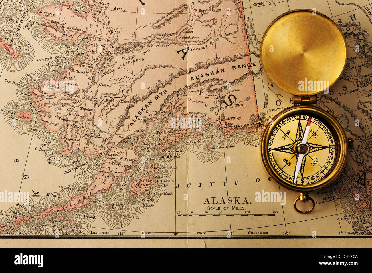 Antique compass over old XIX century map Stock Photo