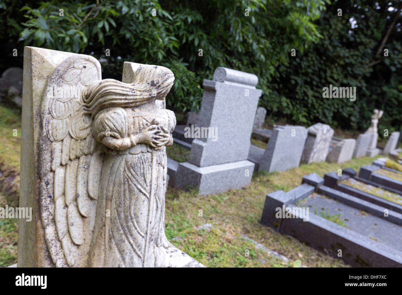 Modern angel guard tombs in the cemetery of Sancreed parish church Stock Photo
