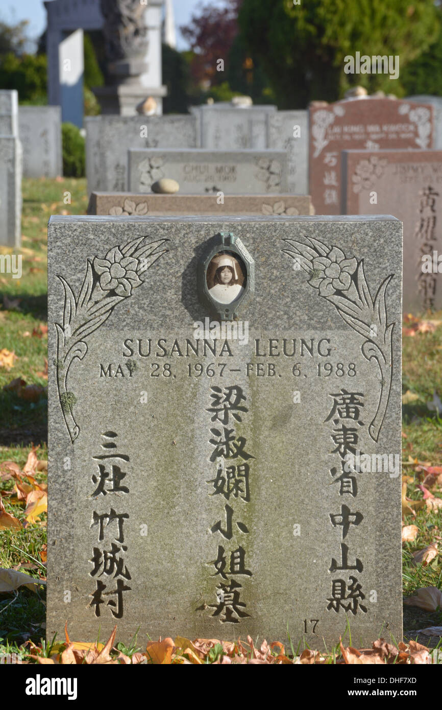 Asian tombstone of a deceased young lady in Cypress Hills Cemetery in Queens, New York Stock Photo