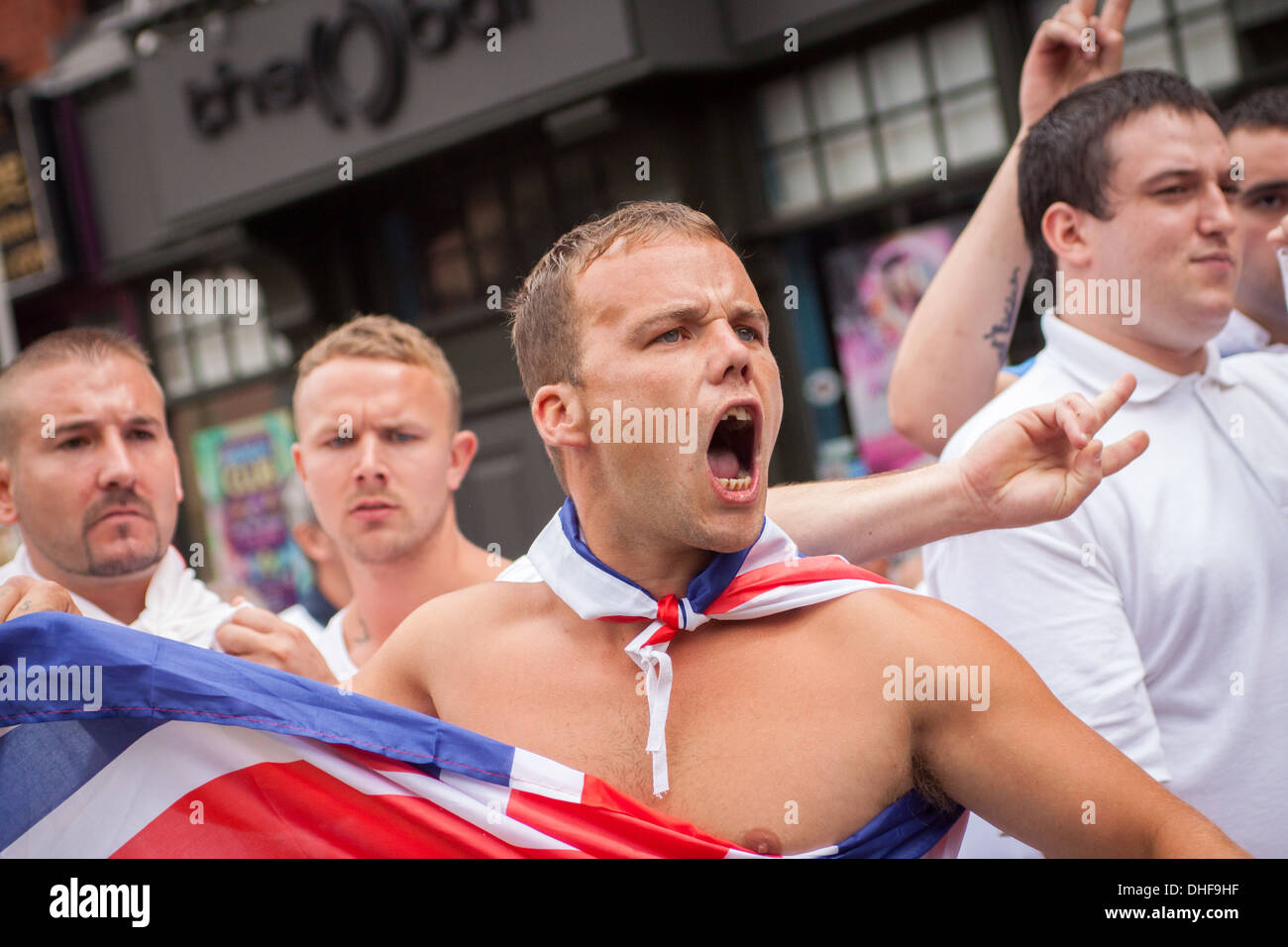 An English Defence League member shouts various chants at the police and passers-by during a rally in Birmingham. Stock Photo