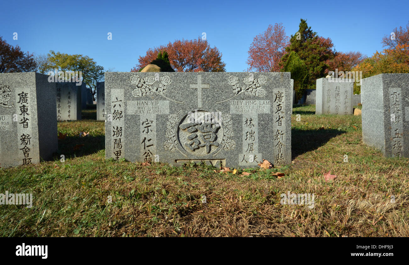 Asian tombstone in Cypress Hills Cemetery in Queens, New York Stock