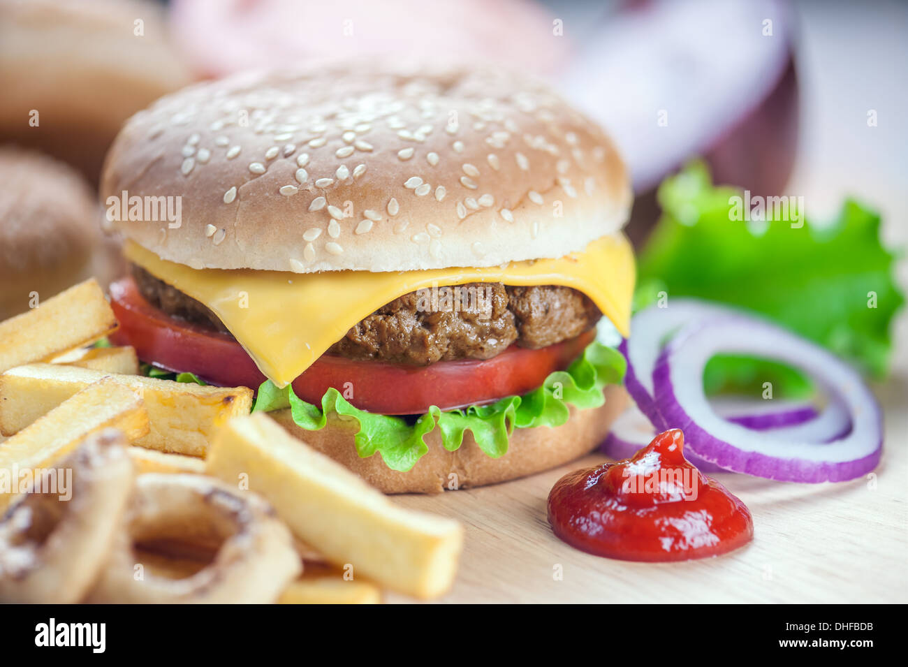 appetizing cheeseburger with red onion closeup Stock Photo