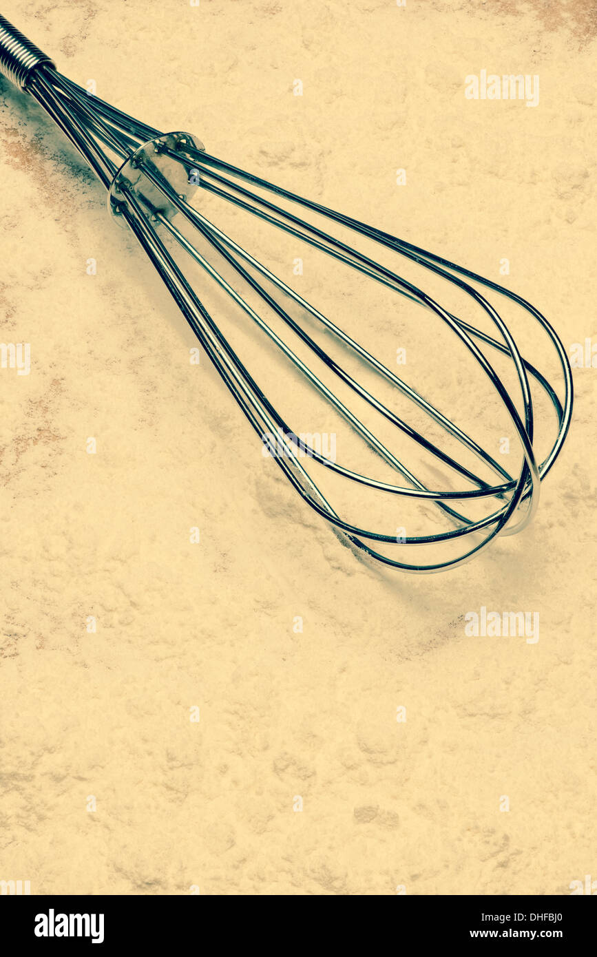 https://c8.alamy.com/comp/DHFBJ0/cross-processed-film-isolated-cooking-whisk-on-flour-DHFBJ0.jpg