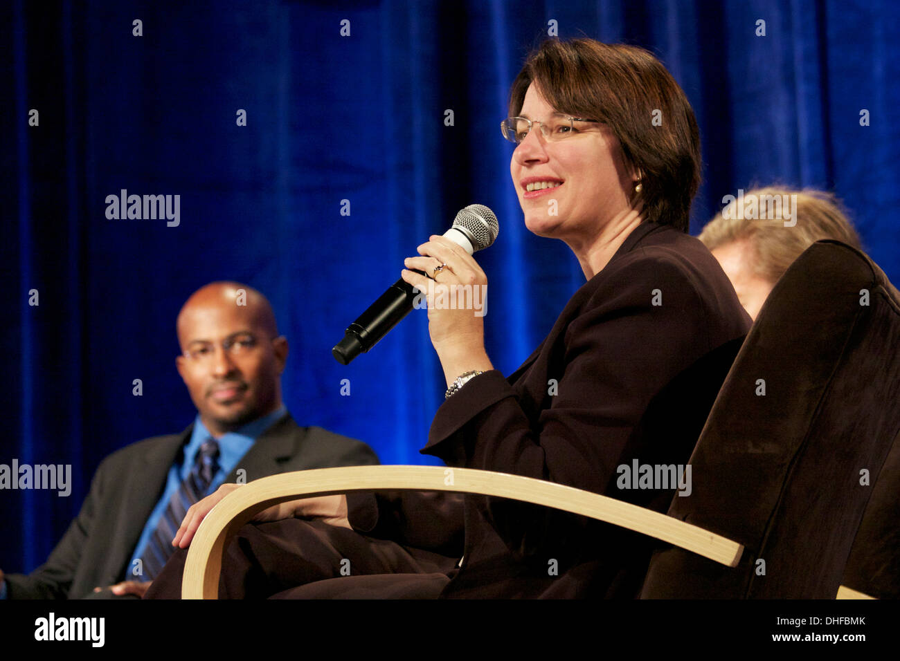 U.S. Senator Amy Klobuchar on panel at Women's Leadership Forum Van Jones in background October 2008 Stock Photo