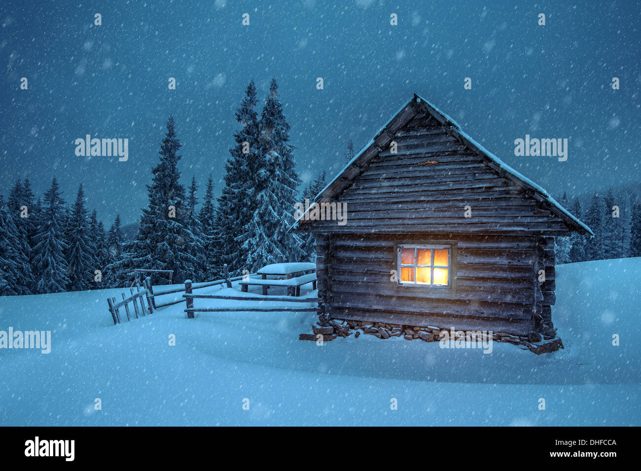 wooden house in winter forest Stock Photo - Alamy