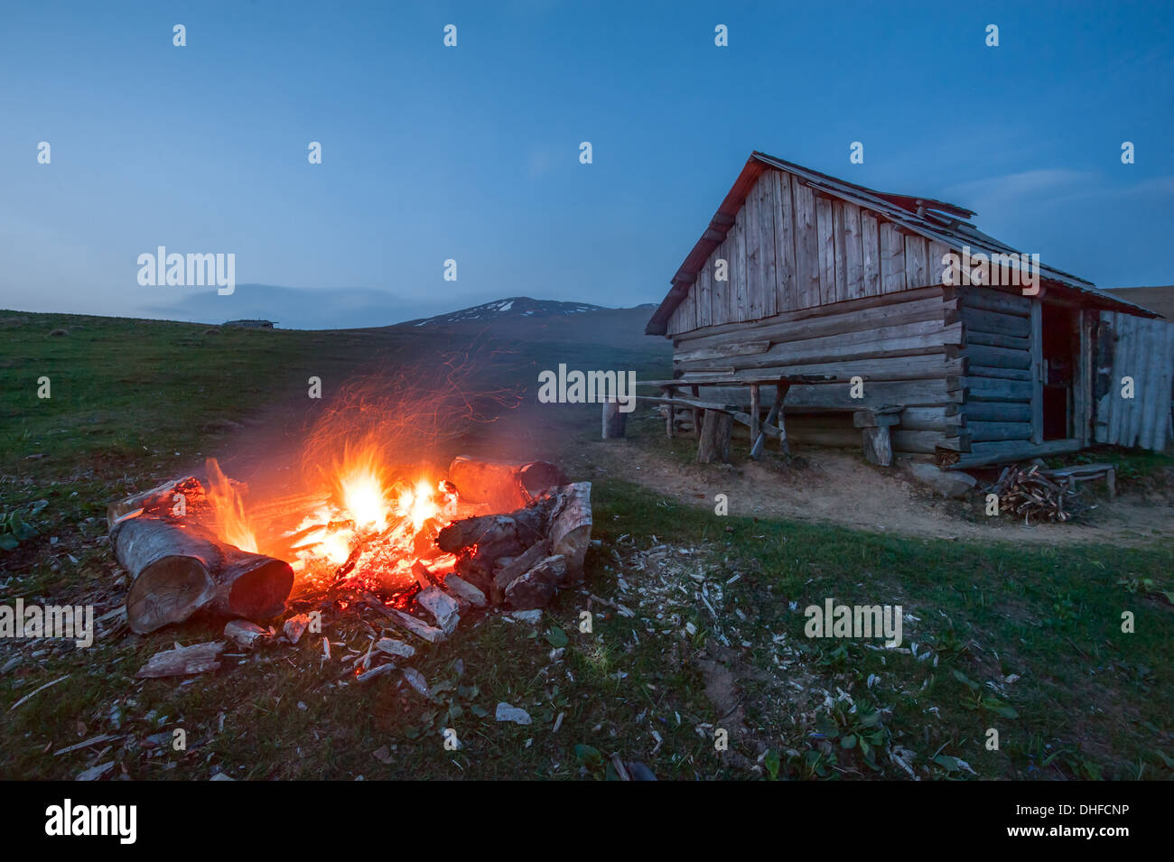 campfire in mountain near hunting house Stock Photo
