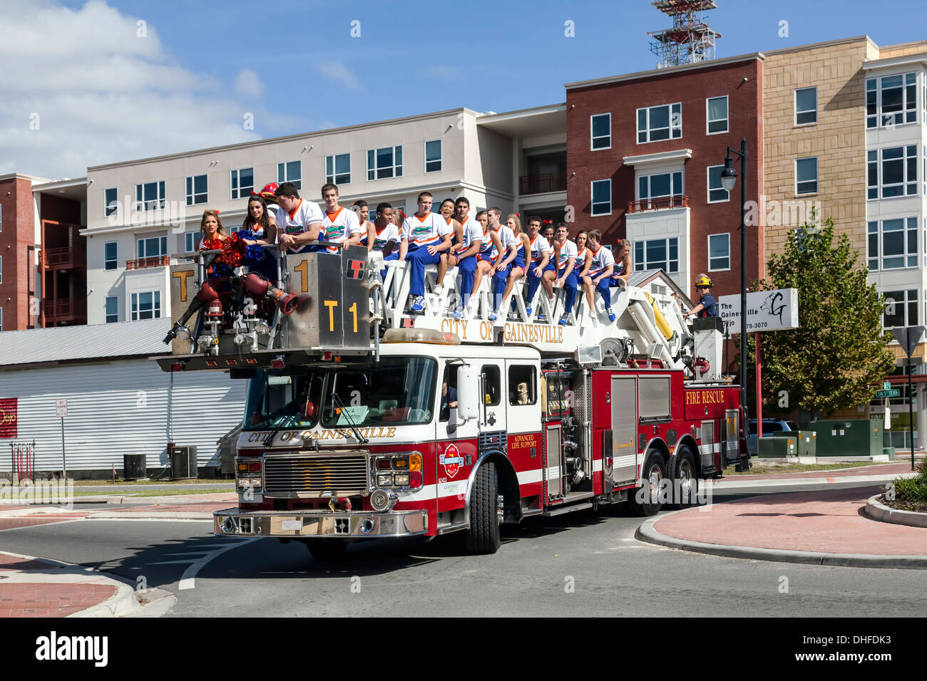 Florida cheer leaders squad riding on a fire truck in the University of