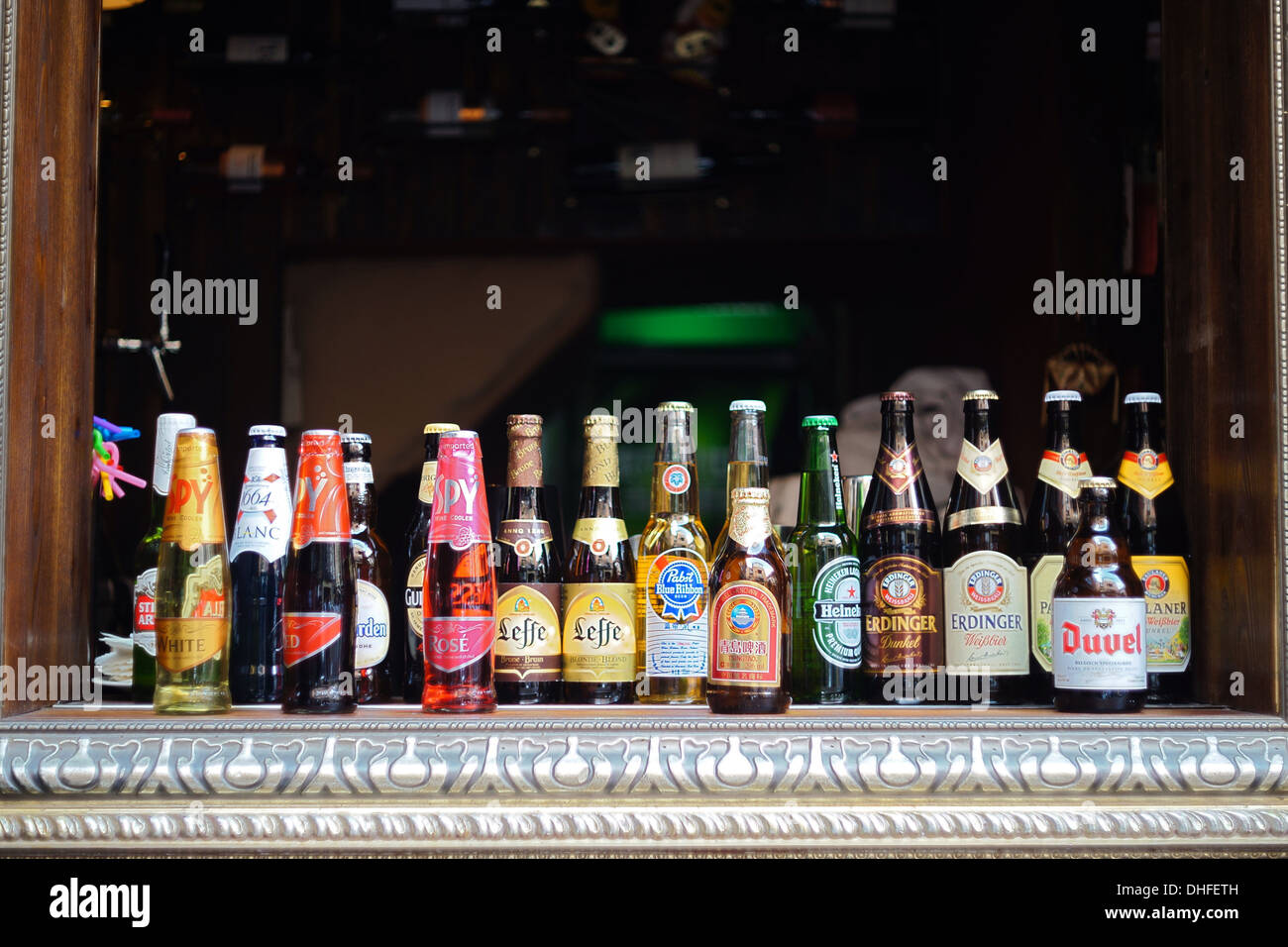Beer bottles on a windowsill Stock Photo