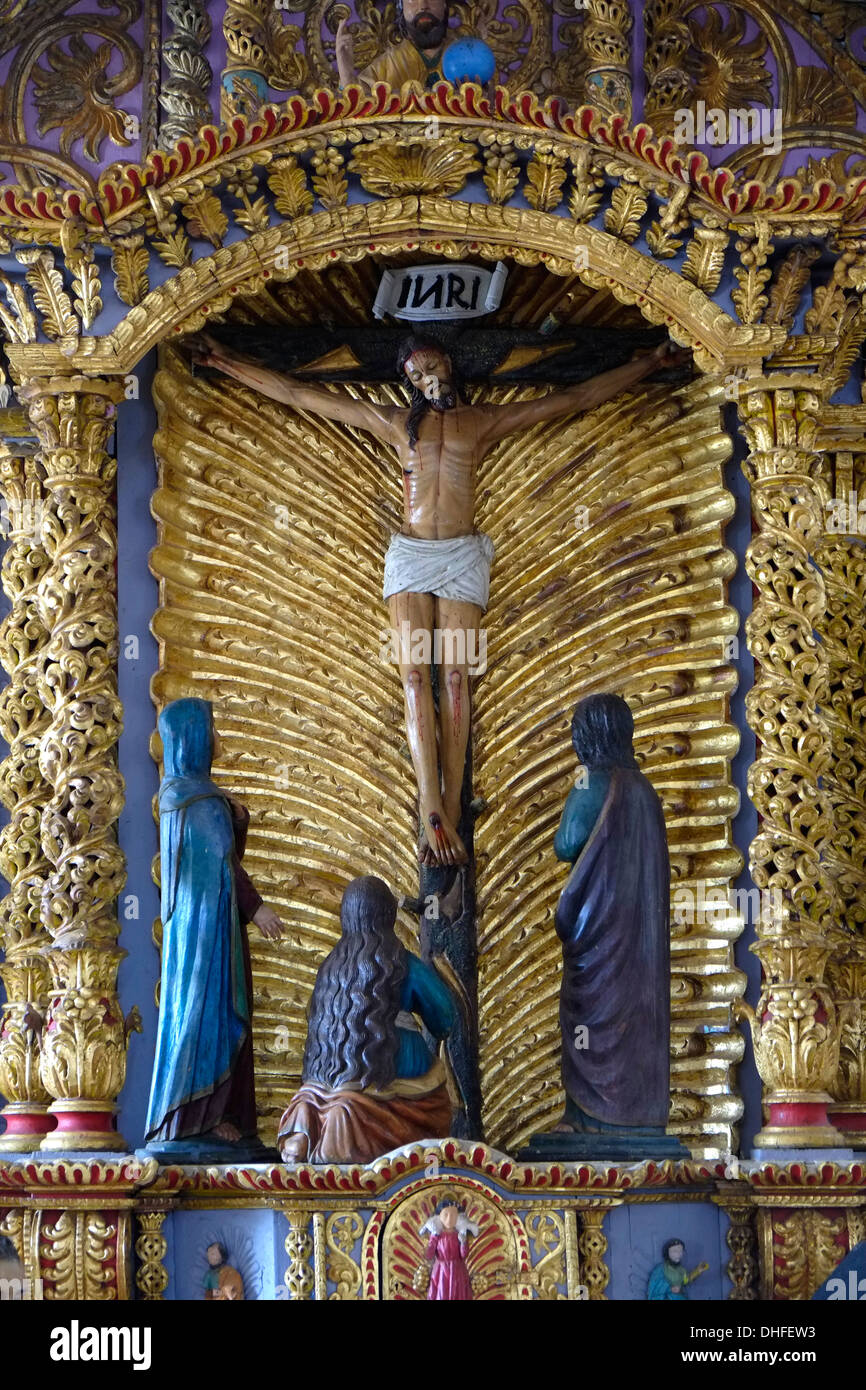 A wooden figure of the Crucifixion of Jesus Christ on the Cross inside Iglesia de San Antanacia church in The Villa de Los Santos town in Peninsula de Azuero Republic of Panama Stock Photo