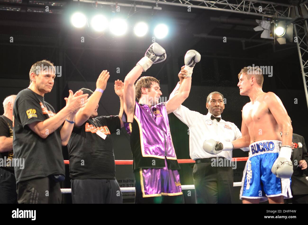 Bristol, UK, City Academy, 8th Nov 2013. Dan Sarkozi (in purple) makes his pro fighting debut & wins v Rahman (blue shorts). © sophie merlo/Alamy Live News Stock Photo
