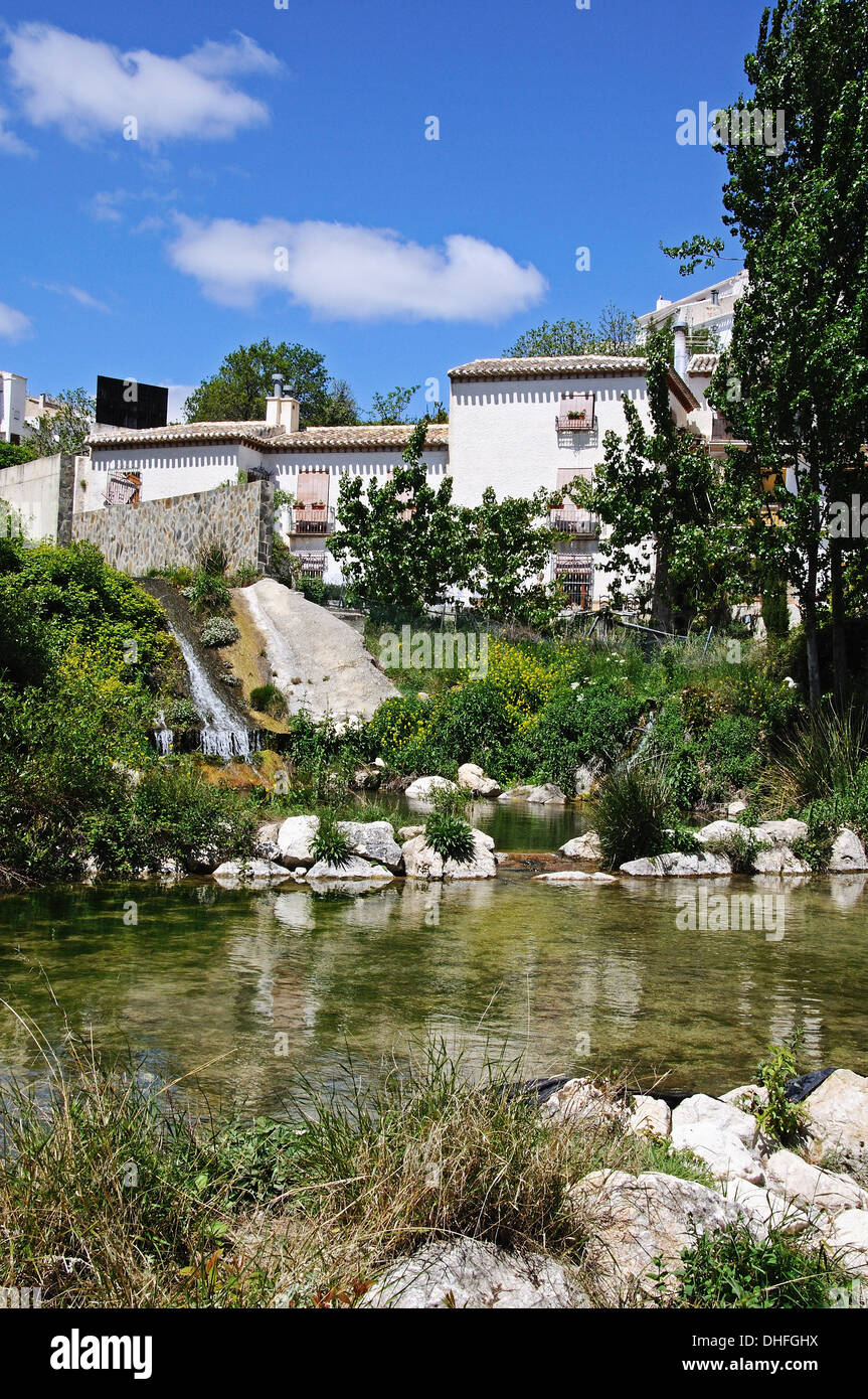Stream through village with townhouses to the rear, Velez Blanco, Almeria Province, Andalusia, Spain, Western Europe. Stock Photo
