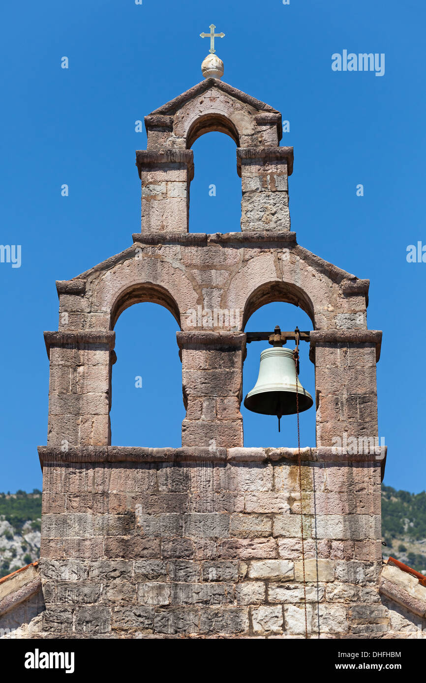 Serbian Orthodox Church bell tower in Petrovac town, Montenegro Stock Photo