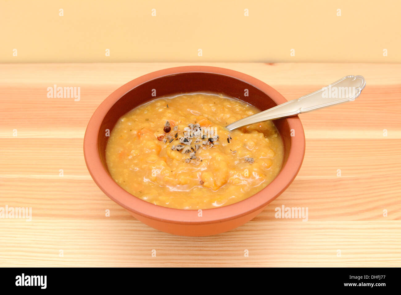 Bowl of hearty lentil and vegetable soup with extra seasoning Stock Photo