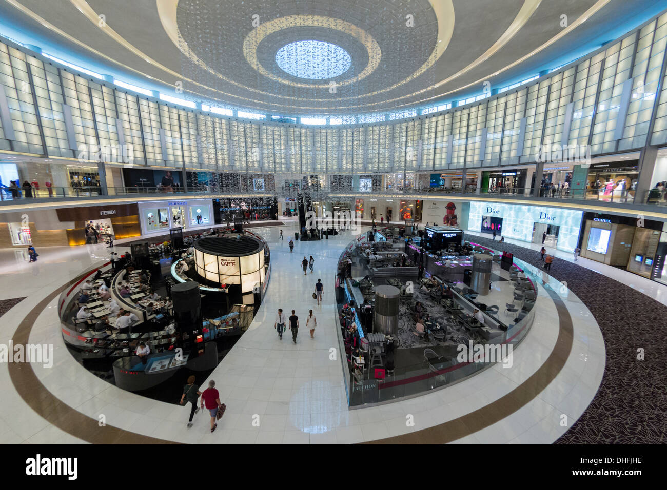 Interior of large atrium with cafes and shops at Dubai Mall in Dubai United Arab Emirates Stock Photo